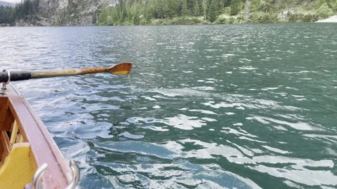 Calm Waters Rowing on a Serene Lake While Being Surrounded by Natures Beauty Stock Footage 280766259
