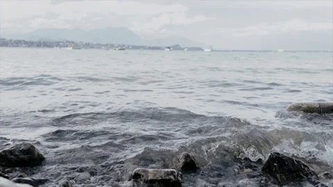 Calm Waves Gently Hitting the Shore on a Peaceful Day Stock Footage 337613380
