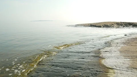 Calm waves lapping the shore Stock Footage 97270820