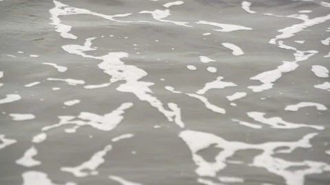 Calm Waves Repeatedly Wash Up On Sandy Shore Stock Footage 261561034