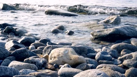 Calm waves on rocky shore Stock Footage 151008933