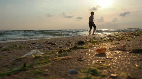 Calm waves roll over the sandy shore. Sunset at sea or ocean. Water movement Stock Footage 252482887