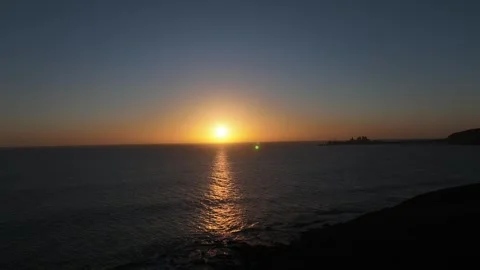 Calm Waves Rolling In and Pier at Sunset – Gran Canaria Aerial Coastline Stock Footage 309940442