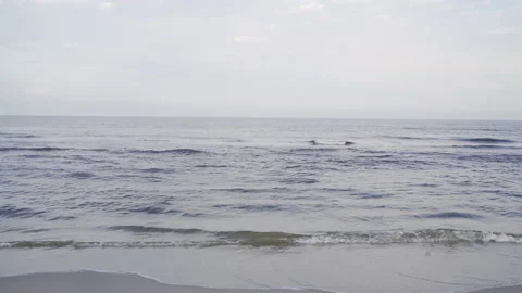 Calm waves rolling onto beach Stock Footage 159094800