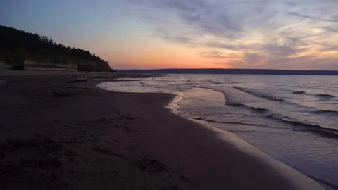 Calm waves on the sea in the evening in summer after sunset. 4k video. Stock Footage 267190976