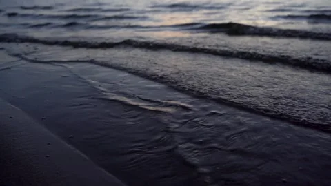 Calm waves on the sea in the evening in summer after sunset. 4k video. Stock Footage 267190980