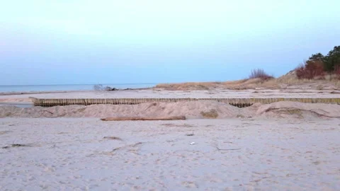 A calm winter scene where the Jamno Canal meets the Baltic Sea in Lazy, Polan Stock Footage 310598954