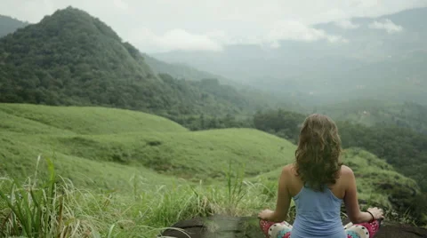 Calm woman meditating on the summit of mountain Stock-Footage 59676203