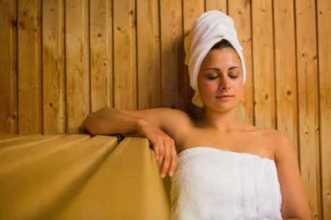 Calm woman relaxing in a sauna Stock Photos