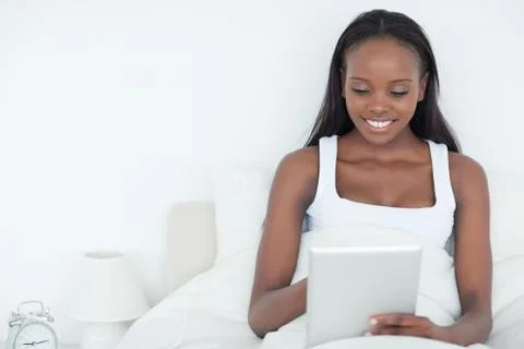 Calm woman using a tablet computer Stock Photos