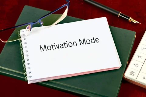 A calm workspace features a notebook titled Motivation Mode, stylish glasses, a Stock Photos