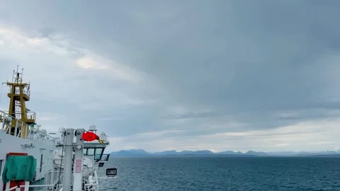 CalMac Ferry Crossing Towards the Outer Hebrides, Scotland Under Dramatic Skies Stock Footage 336523476