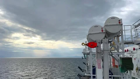 CalMac Ferry Crossing Towards the Outer Hebrides, Scotland Under Dramatic Skies Stock Footage 336523488