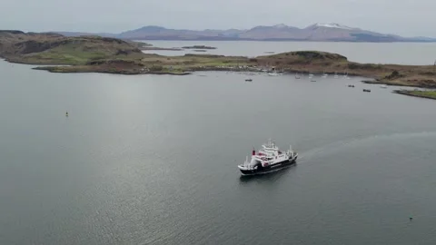 Calmac ferry MV Coruisk heading towards Oban, Kerrera and Mull in background Stock Footage 239449404
