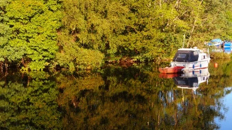 Calmed waters making a mirror effect in a lake Stock Footage 97537965