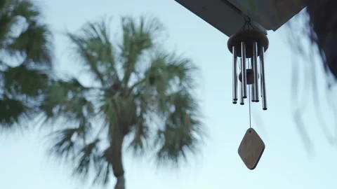 Calming and relaxing view of a wind chime blowing in a tropical garden Vidéo 146426075
