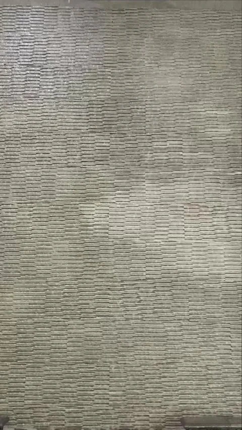 A calming and seamless close-up loop of water gently cascading down Stock Footage 318834984