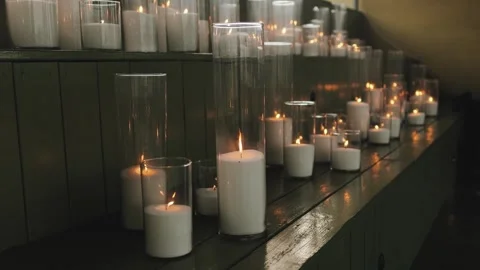 A calming array of candles creates a soothing ambiance, promoting tranquility Video stock 315899008