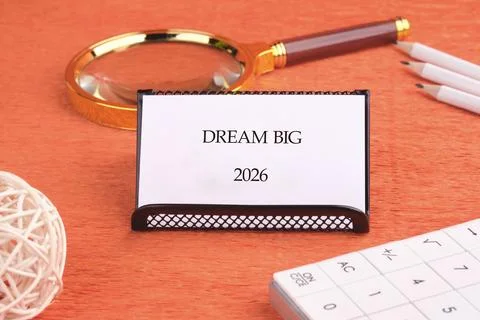 A calming desk setup features a small sign saying Dream Big for the year 2026 Stock Photos
