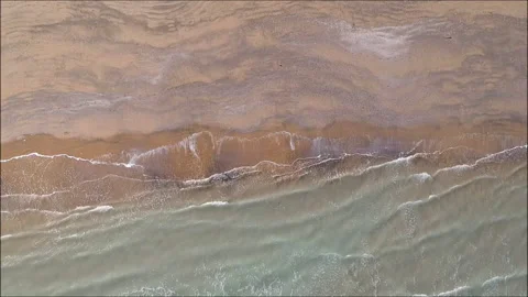 Calming downward view of waves on a beach Stock Footage 147852281