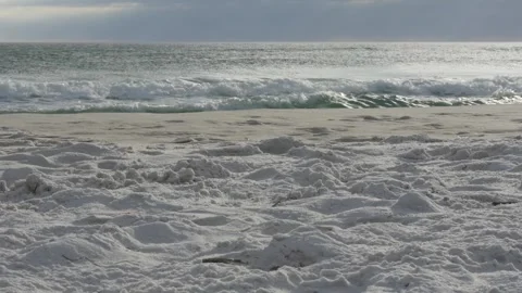 Calming Ocean Waves Crashing on Sandy Shore Stock Footage 307912926