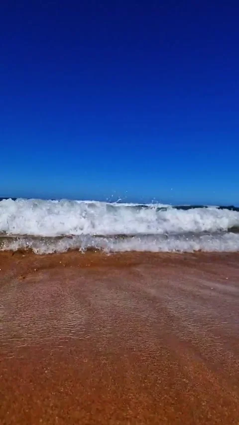 Calming Small Waves Gently Lapping the Beach Shore Stock Footage 286243815