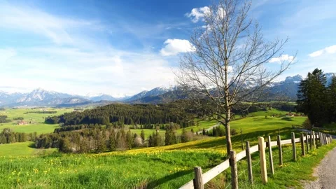 A calming timelapse of clouds drifting across the sky, revealing sweeping vie Stock Footage 309185944