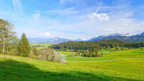 A calming timelapse of peaceful clouds over the expansive foothills, offering Stock Footage 309185704