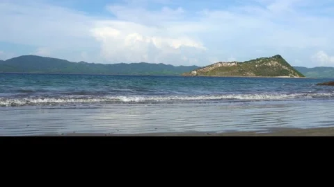 Calminng waves on serene beach Video stock 264625933