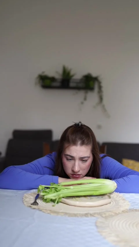 Calorie obsession leaves only celery Stock Footage 339854873