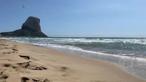 Calpe beach with Ifach Rock and paraglider Stock Footage 331868043