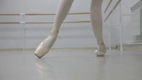 Calves stretching excercise in pointe shoes for ballet close up calves Stock Footage 93777796