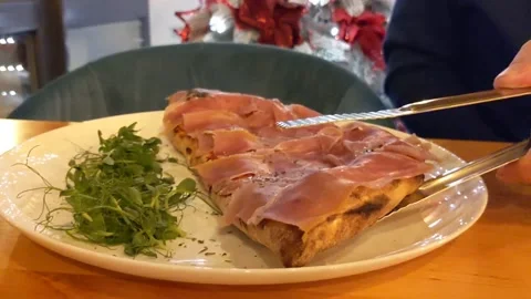 Calzone parma ham. Often described as a turnover, made with leavened dough Stock Footage 224099745
