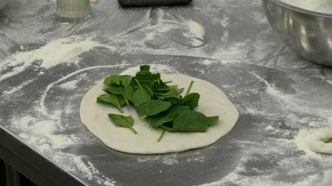 Calzone with tomatoes and spinach Stock Footage 131985990