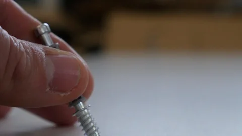 A Cam Lock Screw is inserted using an electric drill Stock-Footage 98662538