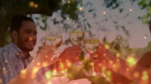 Cam pulling back revealing four adults toasting glasses marking food event under Stock Footage 331570973