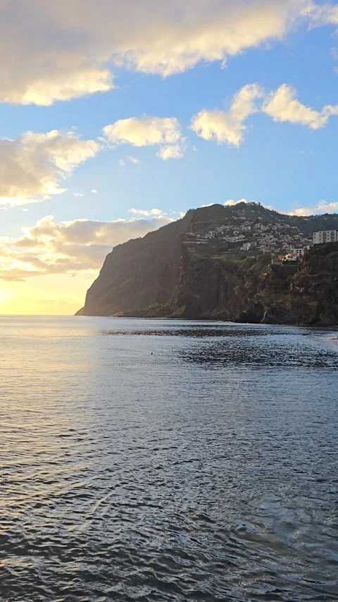 Câmara de Lobos at sunset, where golden skies meet the Atlantic. Stock Footage 310024820