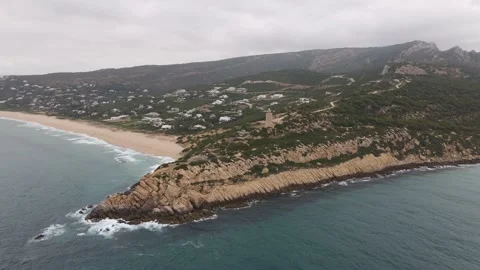 The Camarinal lighthouse and with a beach on the Atlantic. Stock Footage 134670957