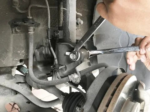 Camber bolt adjustment for wheel alignment Stock Photos