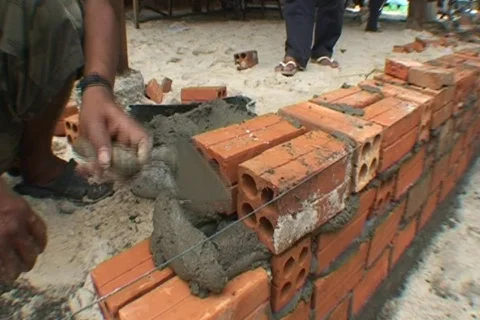 CAMBODIA-LAYING BRICKS 1 Stock Footage 815995