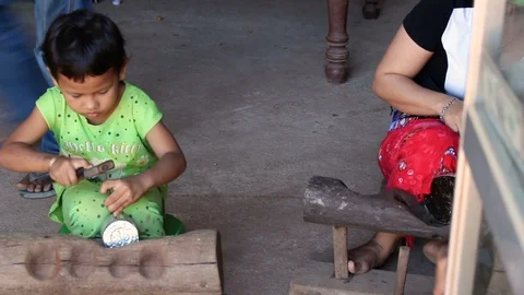 Cambodian child working on silver oject EDI MF Stock Footage 90946569