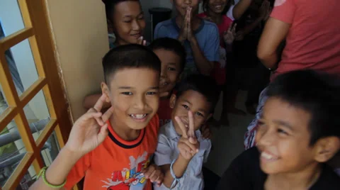 Cambodian Orphans Showing the Peace Sign Stock Footage