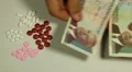 Cambodian Riel KHR, Counting Drugs and Money, Health Care, Colorful Pills HD Footage