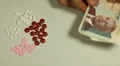 Cambodian Riel KHR, Counting Drugs and Money, Health Care, Colorful Pills HD Footage