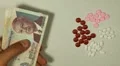 Cambodian Riel KHR, Counting Drugs and Money, Health Care, Colorful Pills HD Footage