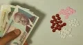 Cambodian Riel KHR, Counting Drugs and Money, Health Care, Colorful Pills HD Footage