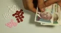 Cambodian Riel KHR, Counting Drugs and Money, Health Care, Colorful Pills HD Footage
