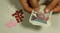 Cambodian Riel KHR, Counting Drugs and Money, Health Care, Colorful Pills HD Footage