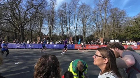 Cambridge Half Marathon 2025 - Runner collapses Stock Footage 313953062