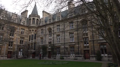 Cambridge University England courtyard woman walking 4K Stock Footage